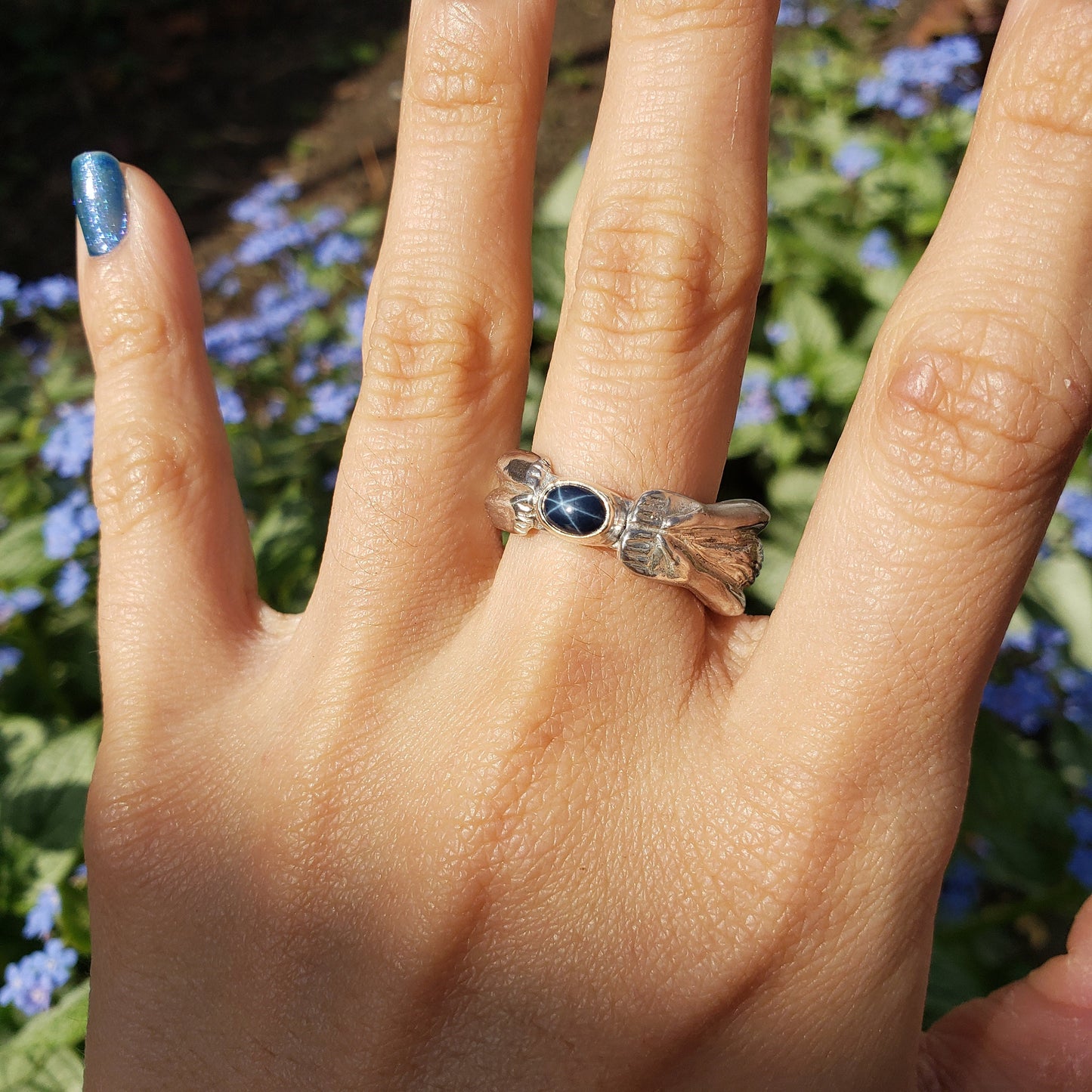 Blue star sapphire back bend ring