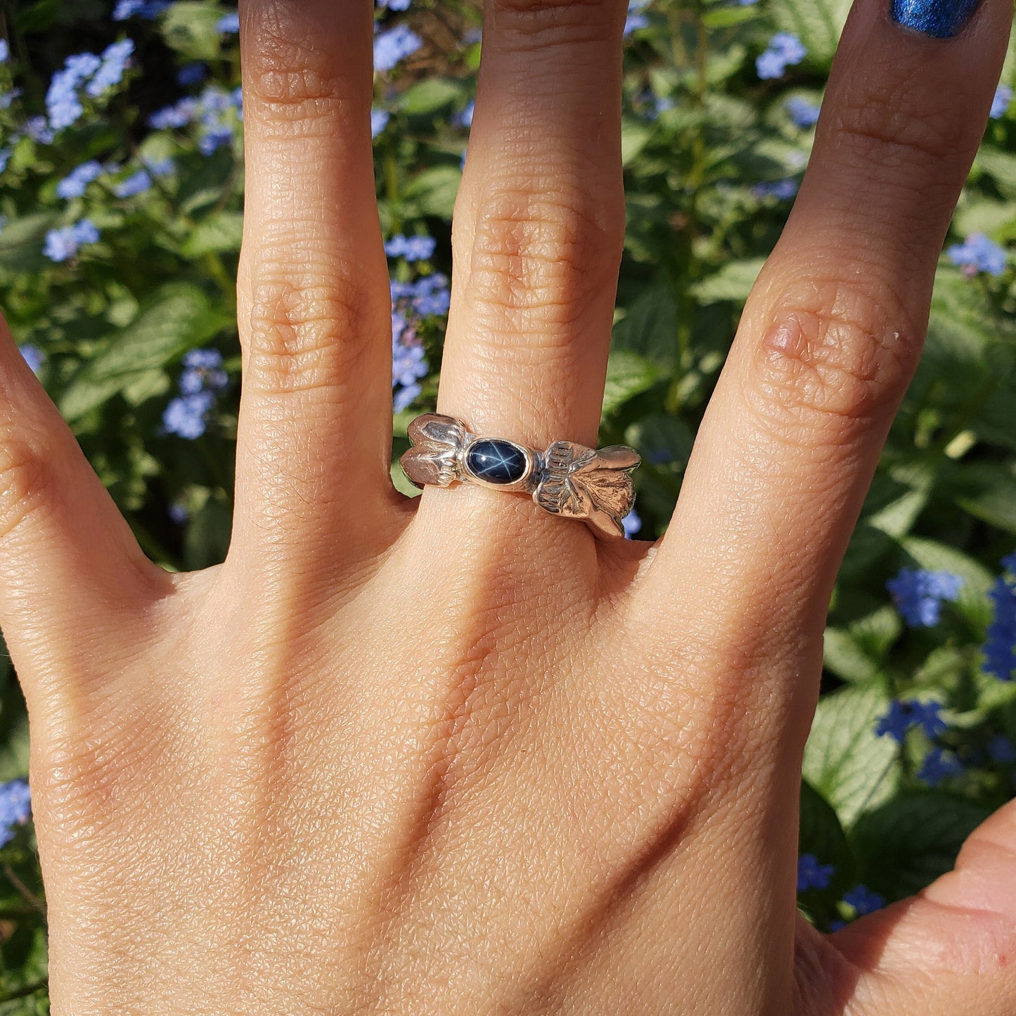 Blue star sapphire back bend ring