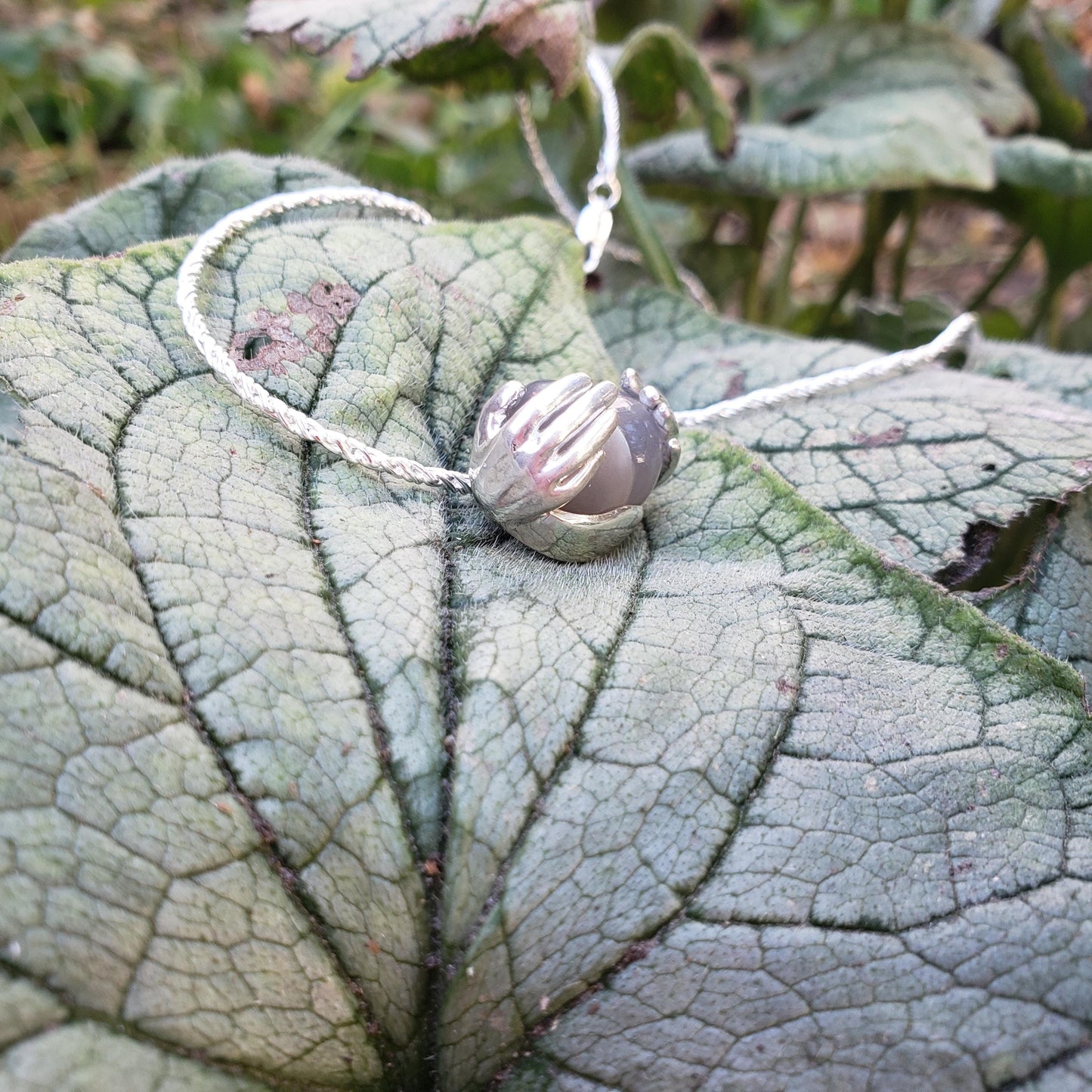 spreading moon moonstone pendant
