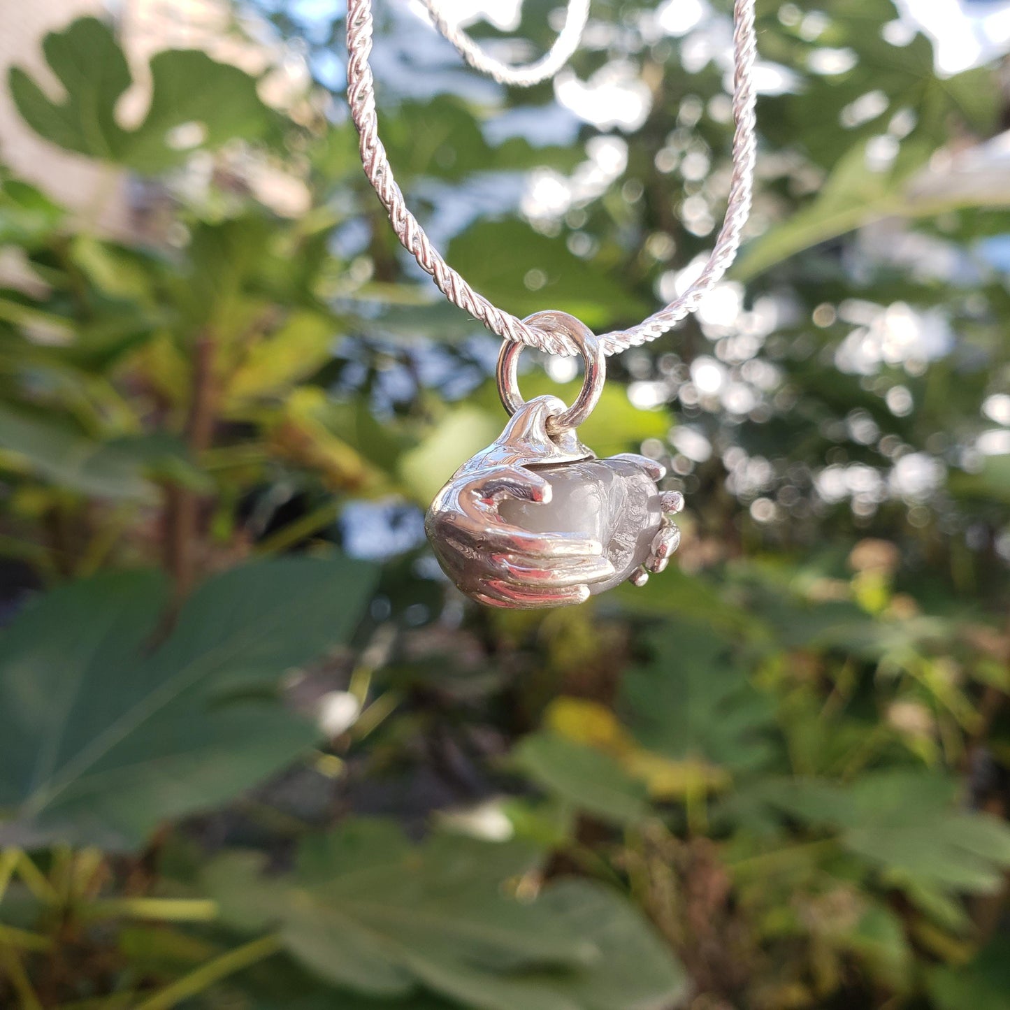 spreading moon moonstone pendant
