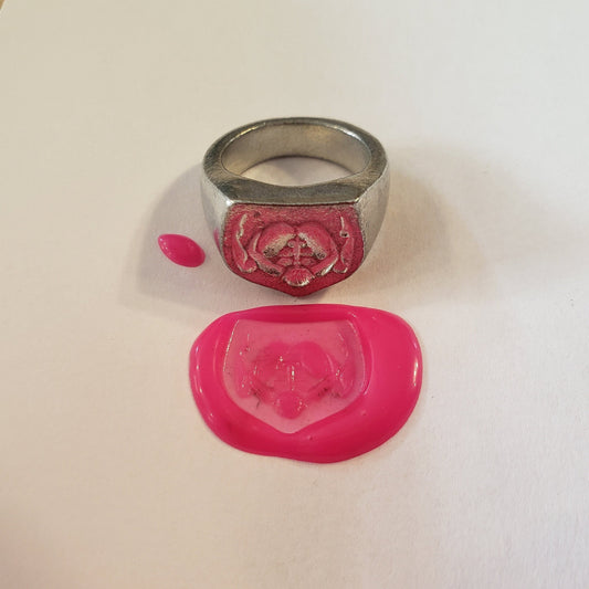 Autofellatio wax seal signet ring