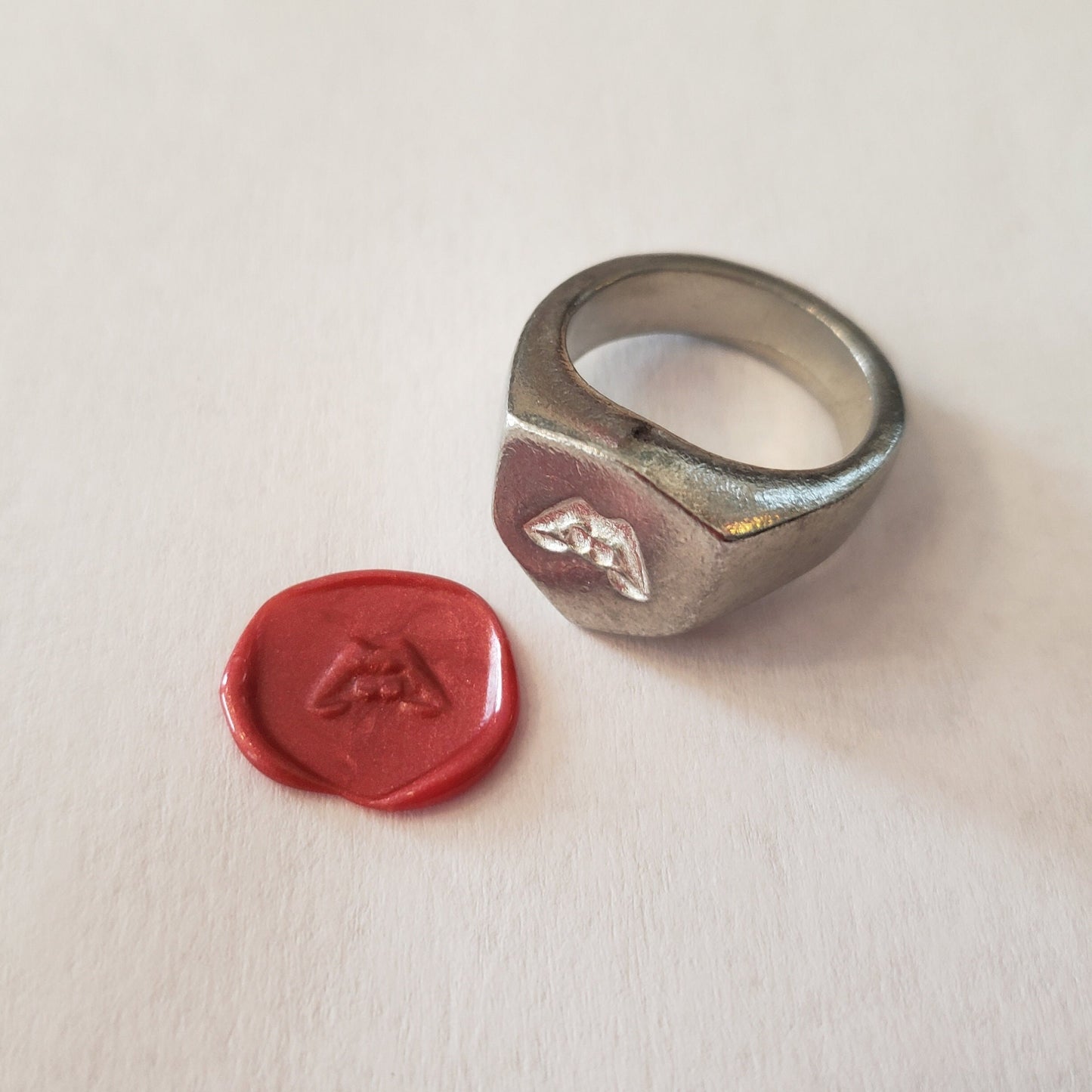 Lip biting wax seal signet ring