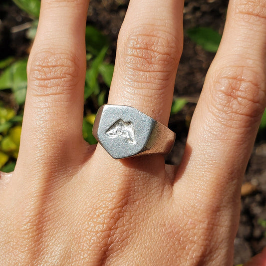 Lip biting wax seal signet ring