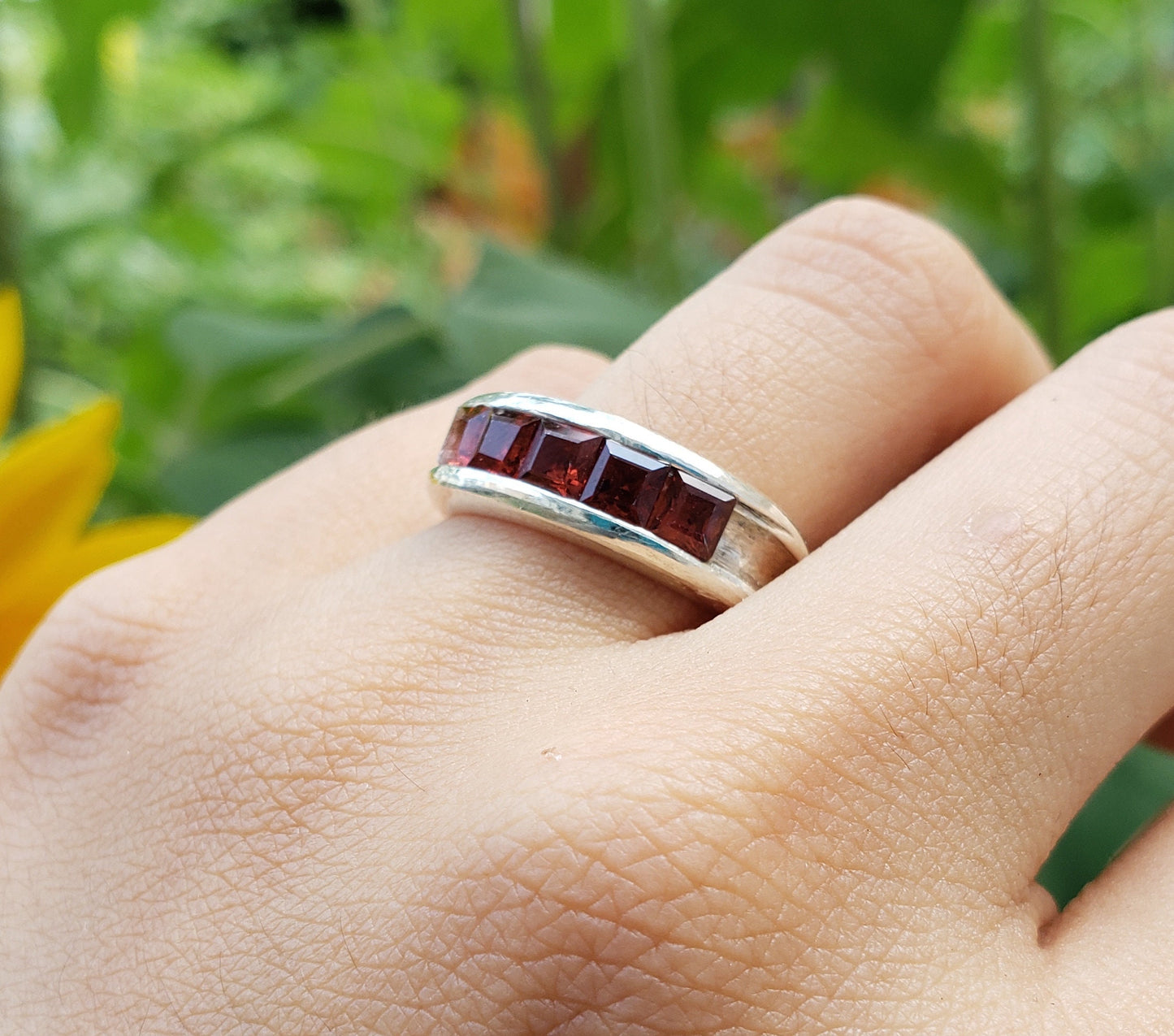 5 stone garnet channel ring