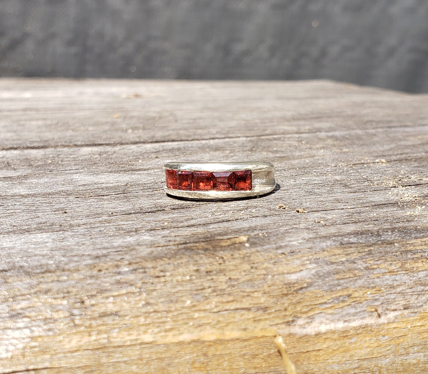 5 stone garnet channel ring