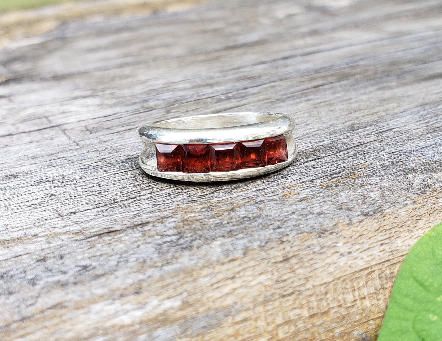 5 stone garnet channel ring