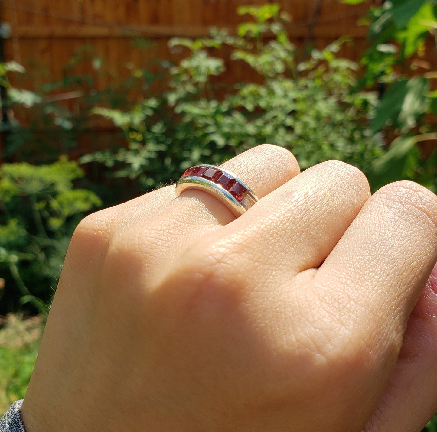 5 stone garnet channel ring