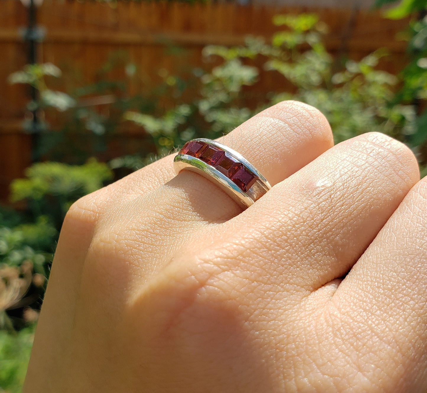 5 stone garnet channel ring