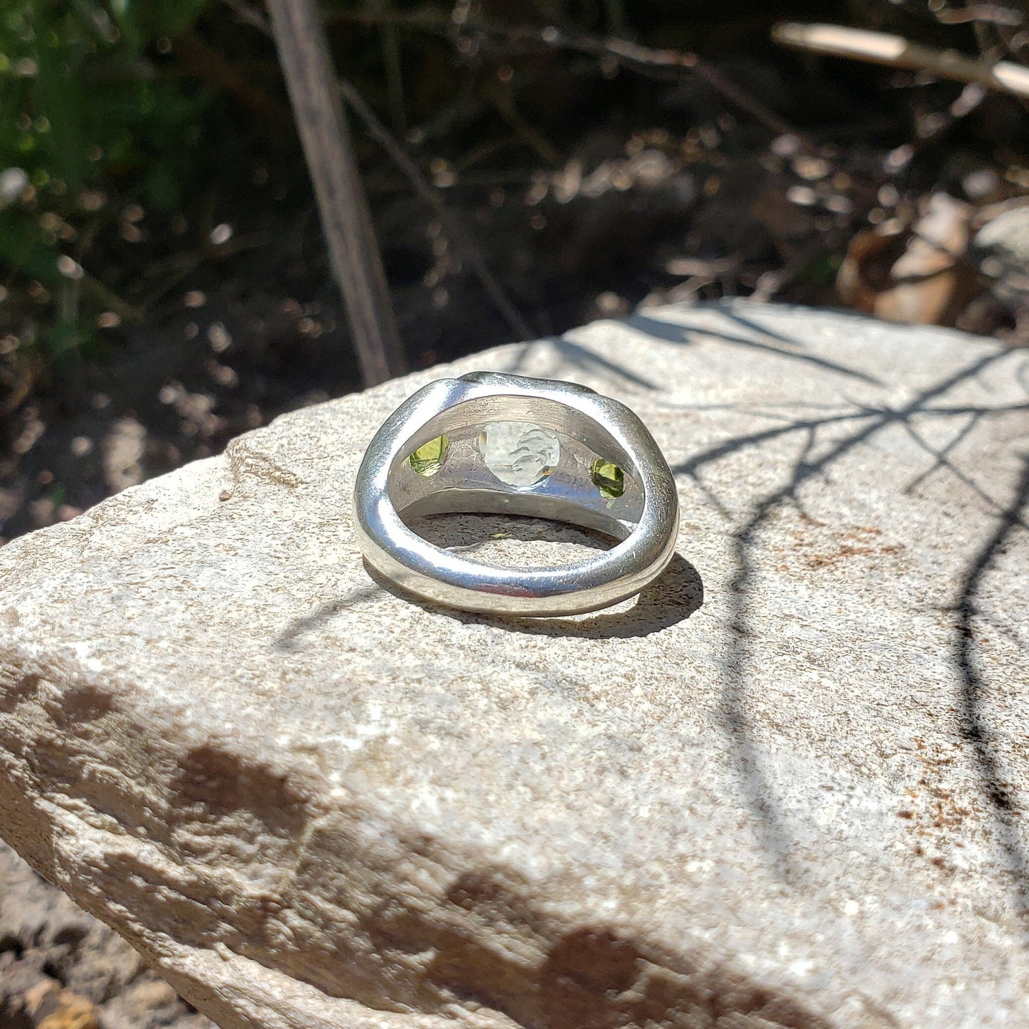 Face looking into space aquamarine and peridot ring