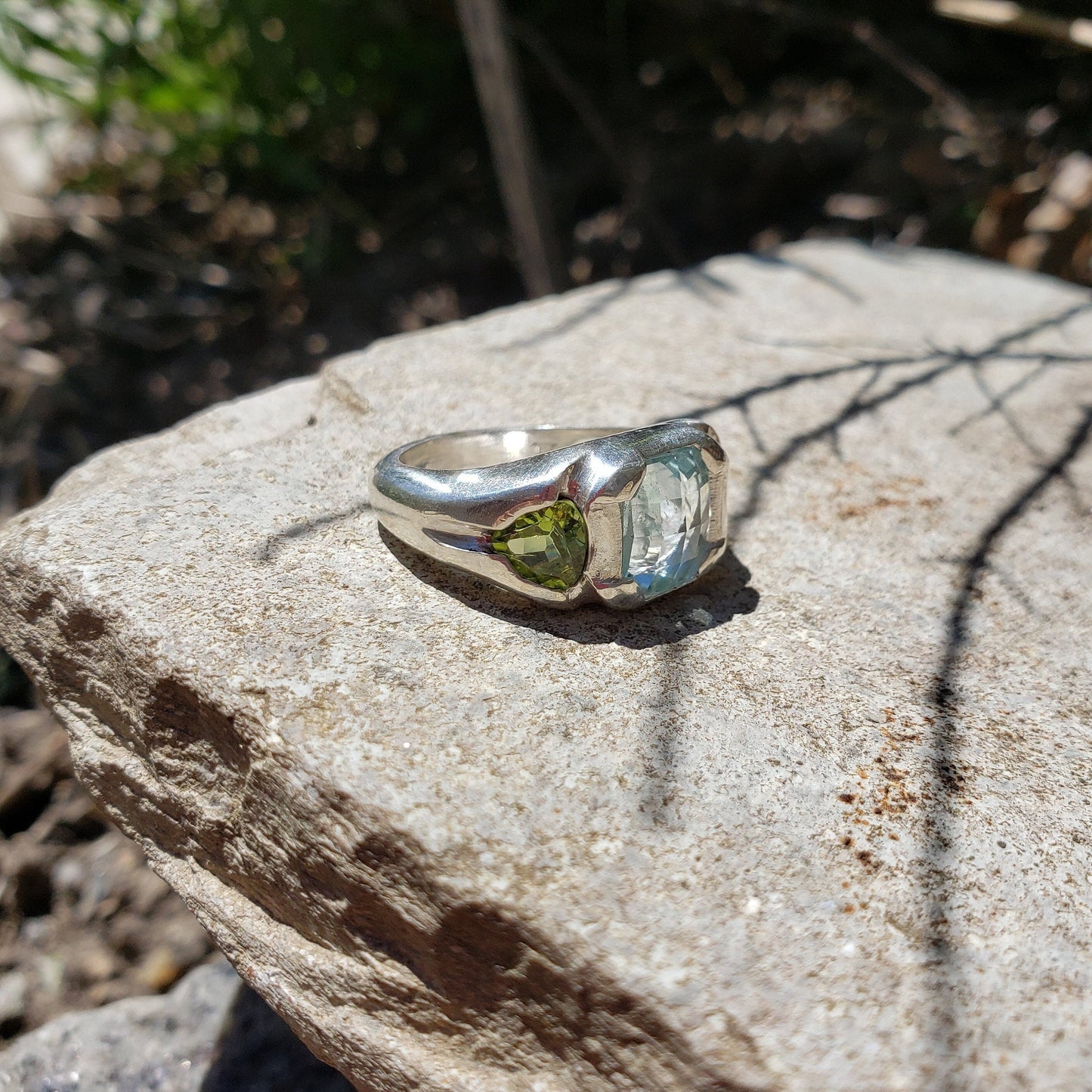 Face looking into space aquamarine and peridot ring