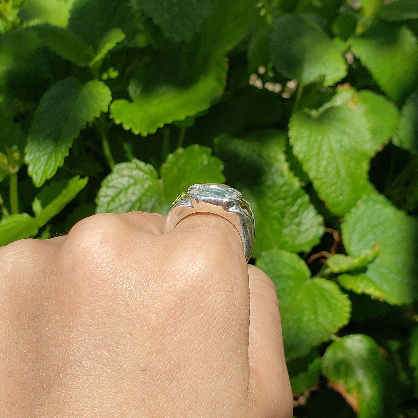 Face looking into space aquamarine and peridot ring