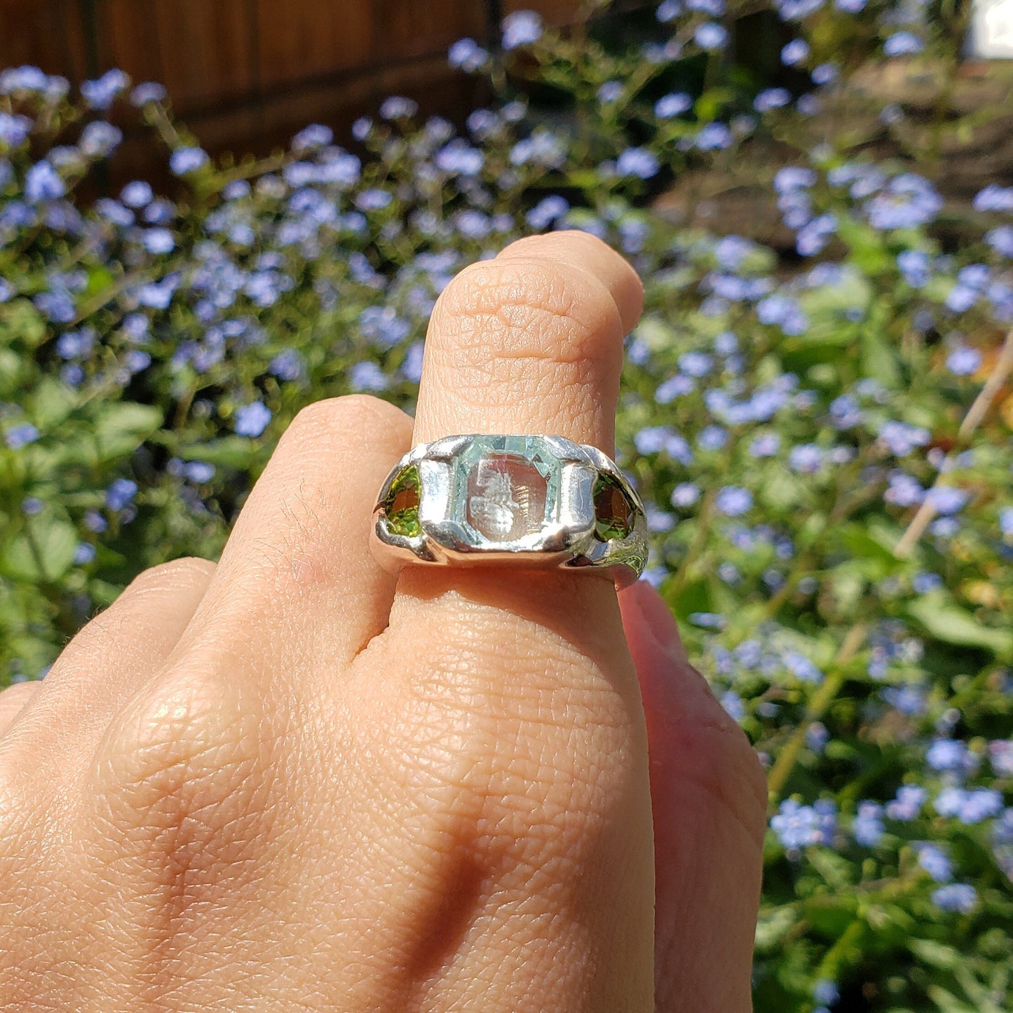 Face looking into space aquamarine and peridot ring