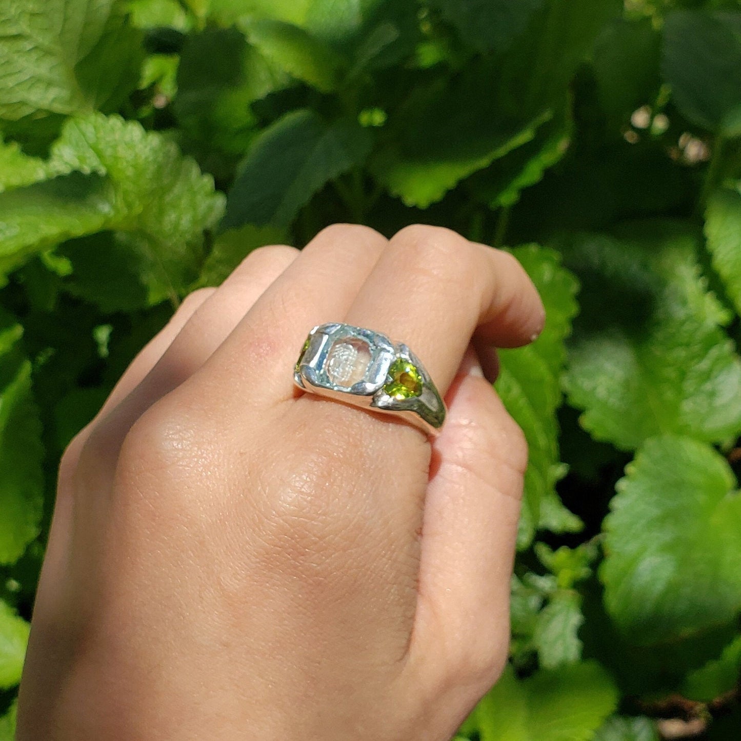 Face looking into space aquamarine and peridot ring