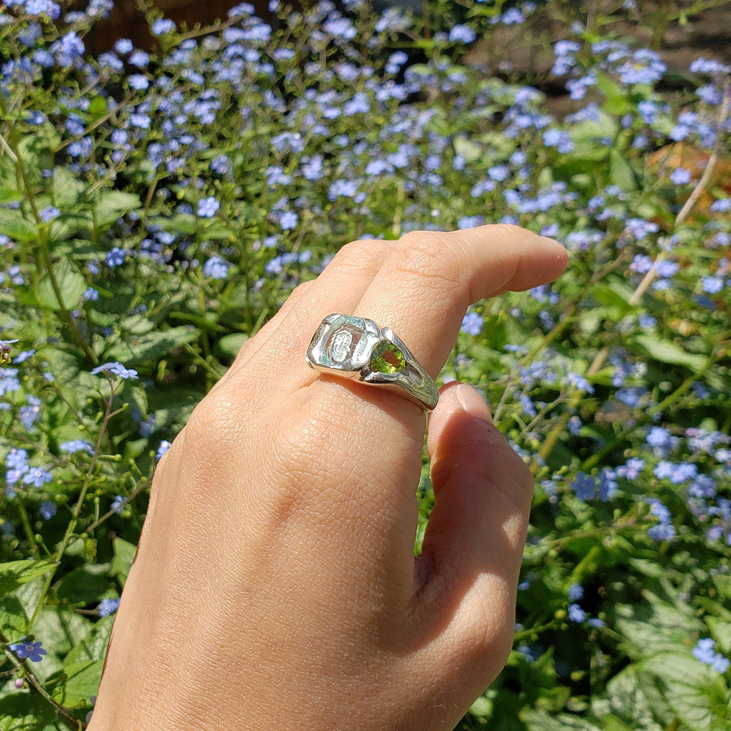 Face looking into space aquamarine and peridot ring