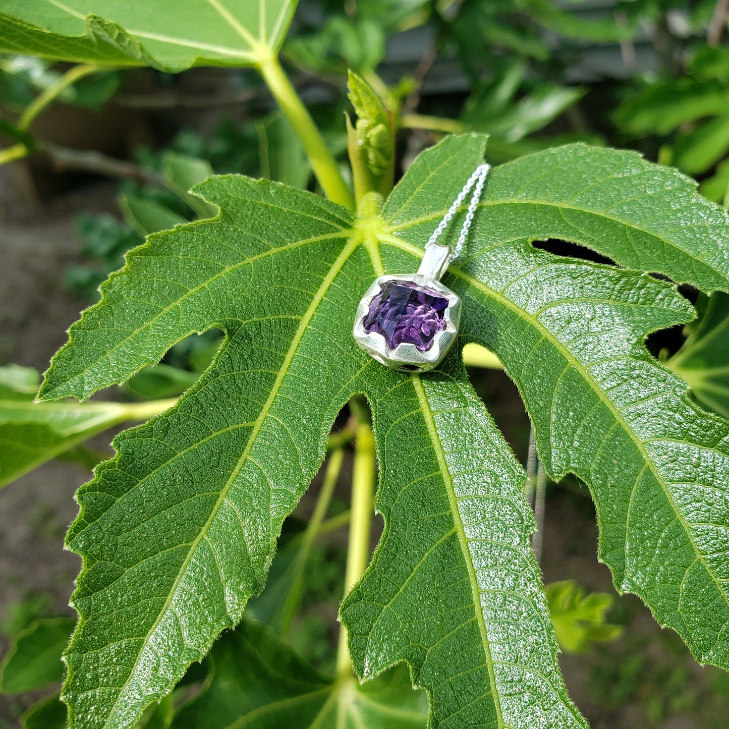 Reverse intaglio daisy amethyst pendant