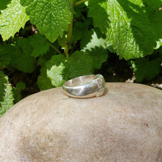 Tongue out reverse intaglio face in a Heliodor ring