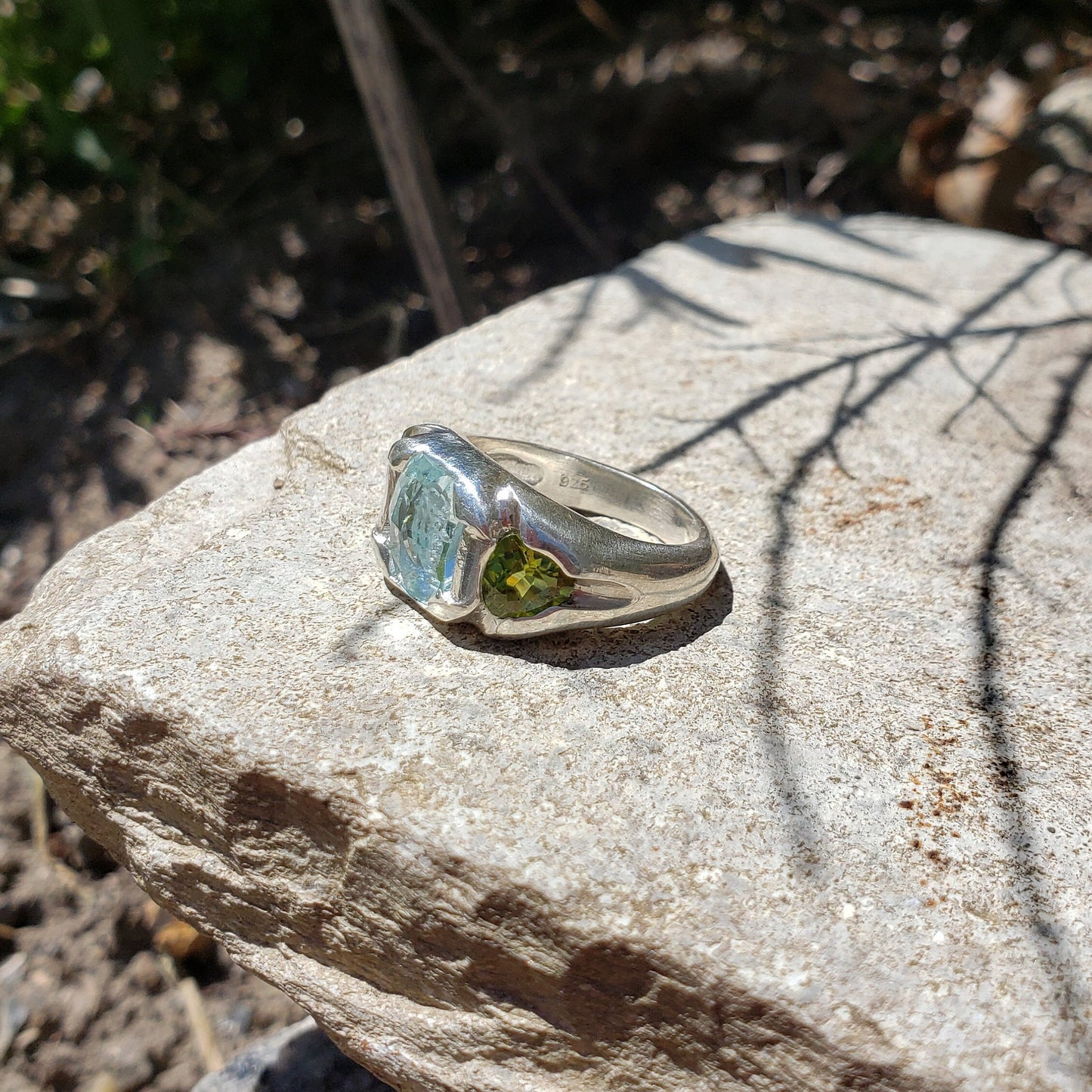 Face looking into space aquamarine and peridot ring