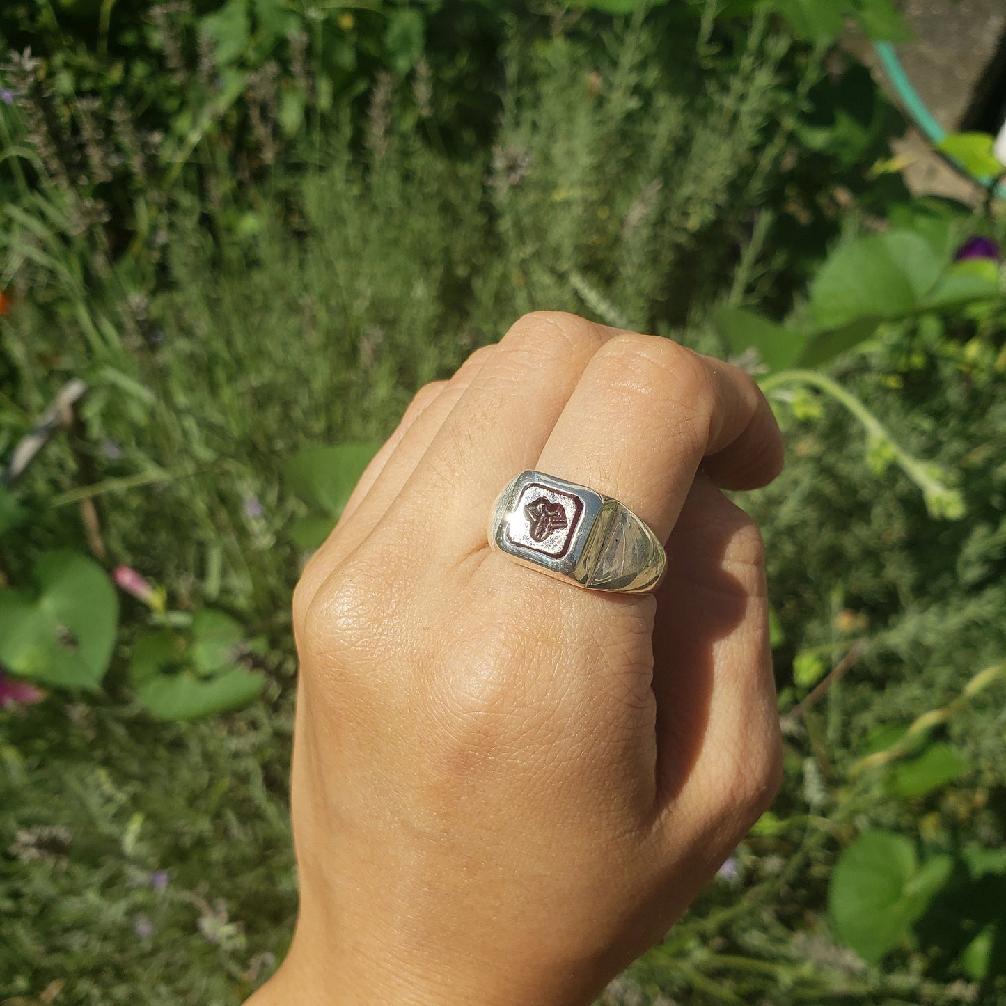 Tongue out garnet signet ring