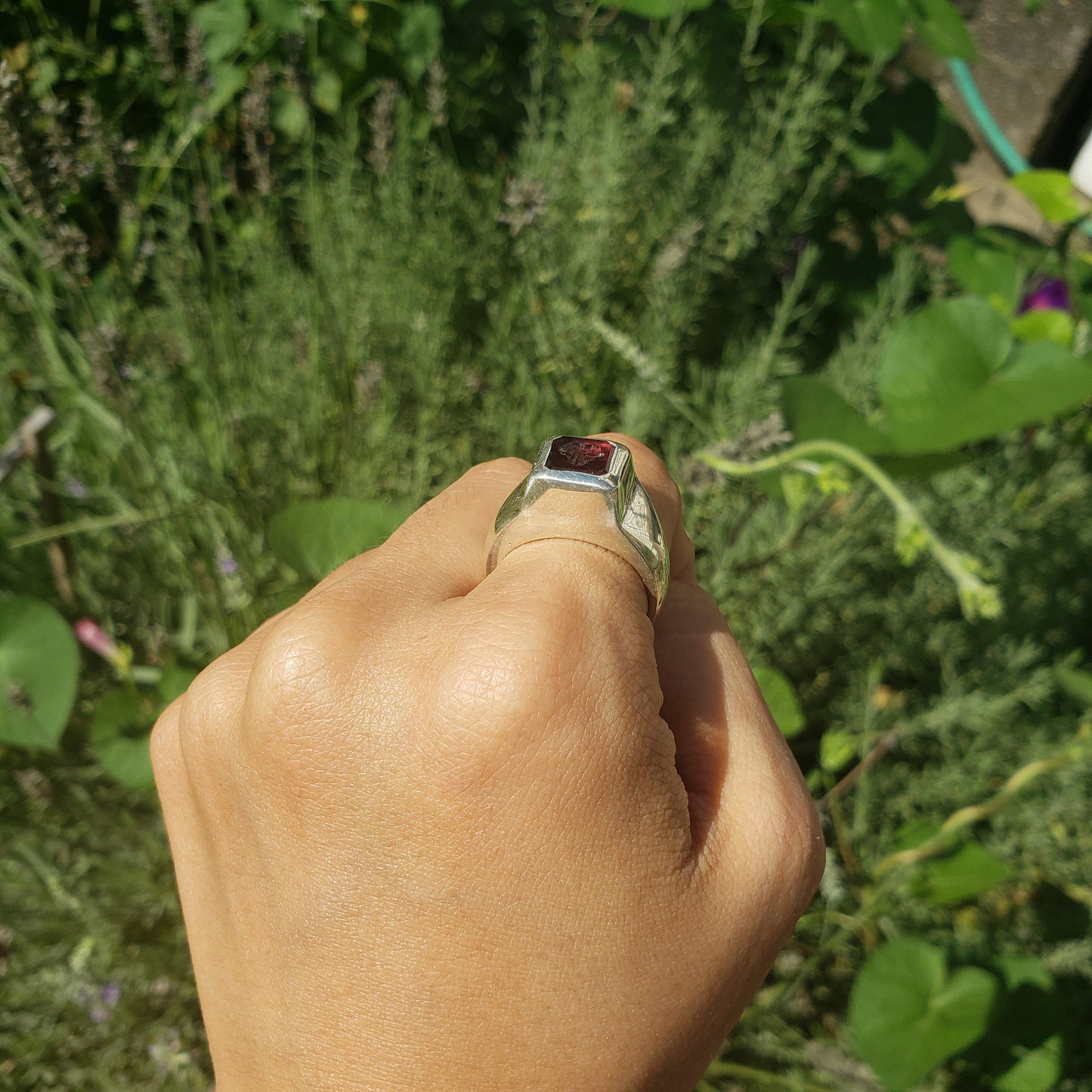 Tongue out garnet signet ring