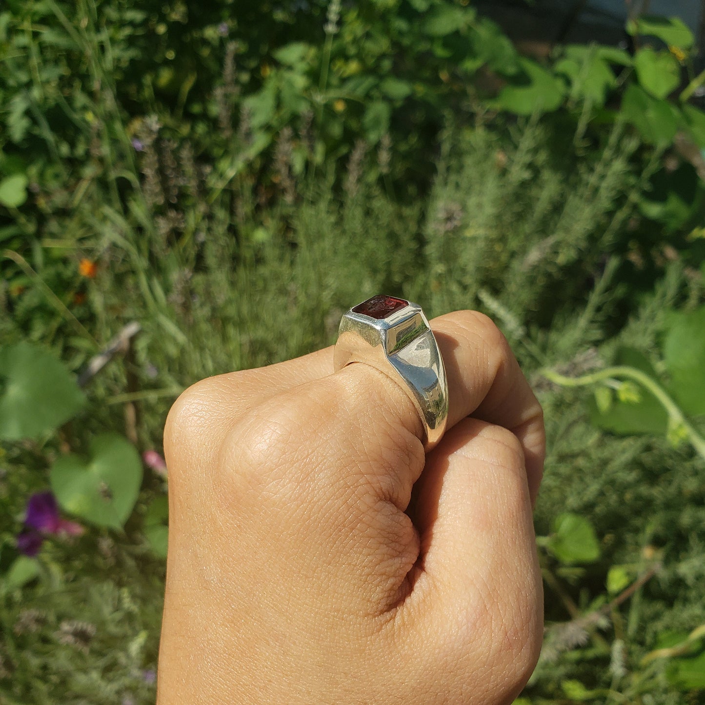 Tongue out garnet signet ring