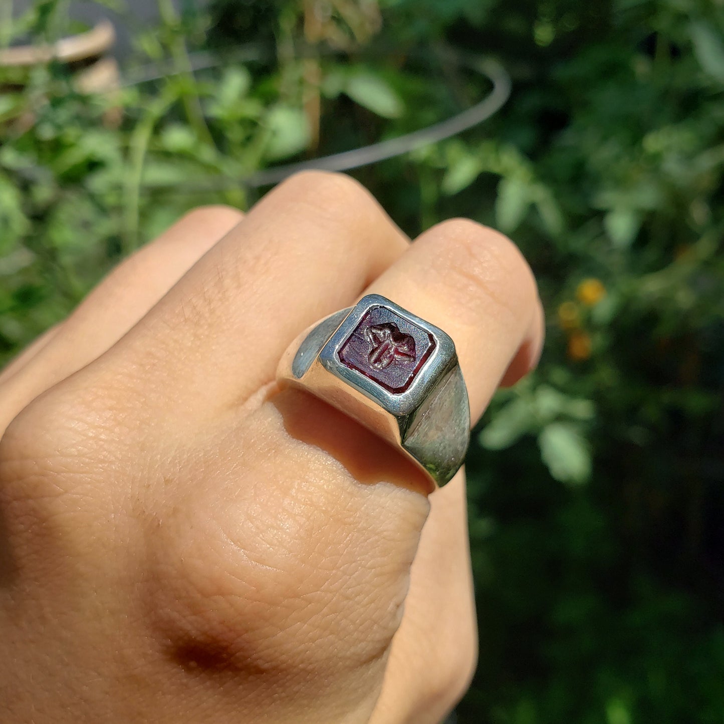 Tongue out garnet signet ring