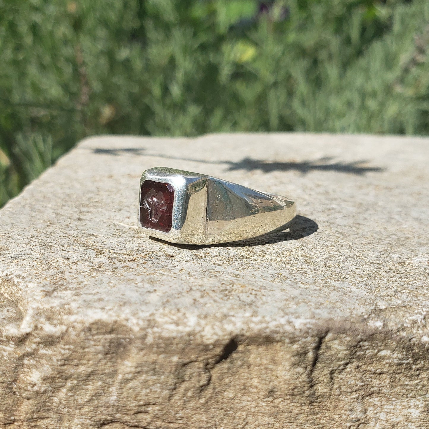 Tongue out garnet signet ring