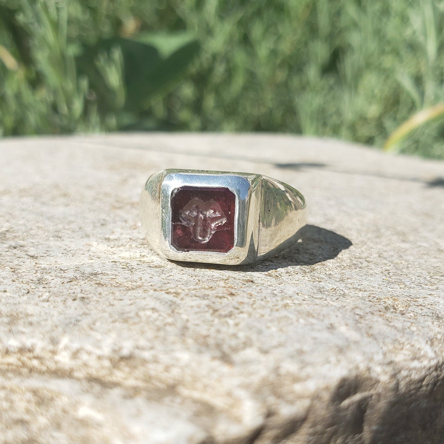 Tongue out garnet signet ring