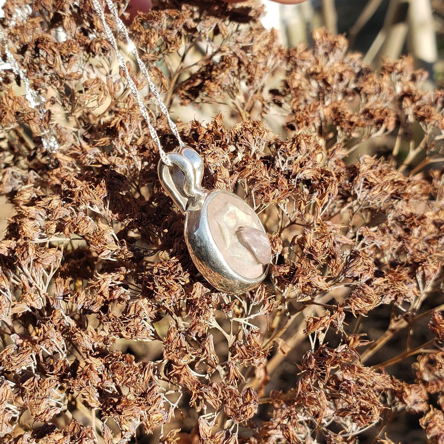 tongue out hardstone cameo pendant