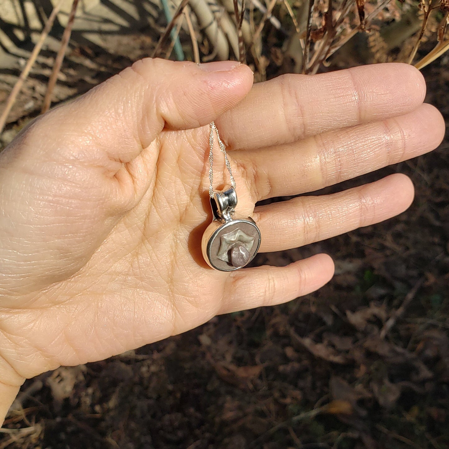 tongue out hardstone cameo pendant