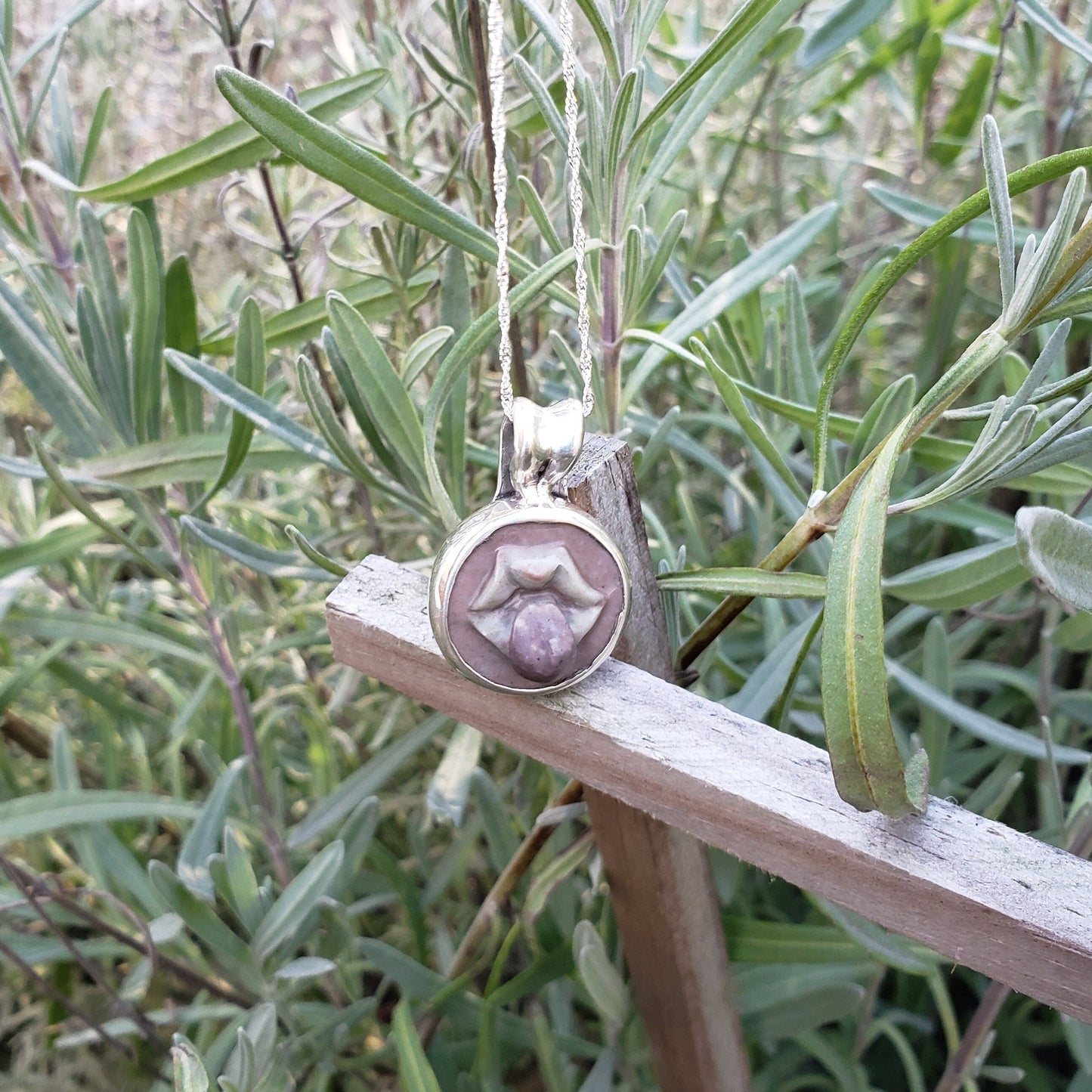 tongue out hardstone cameo pendant