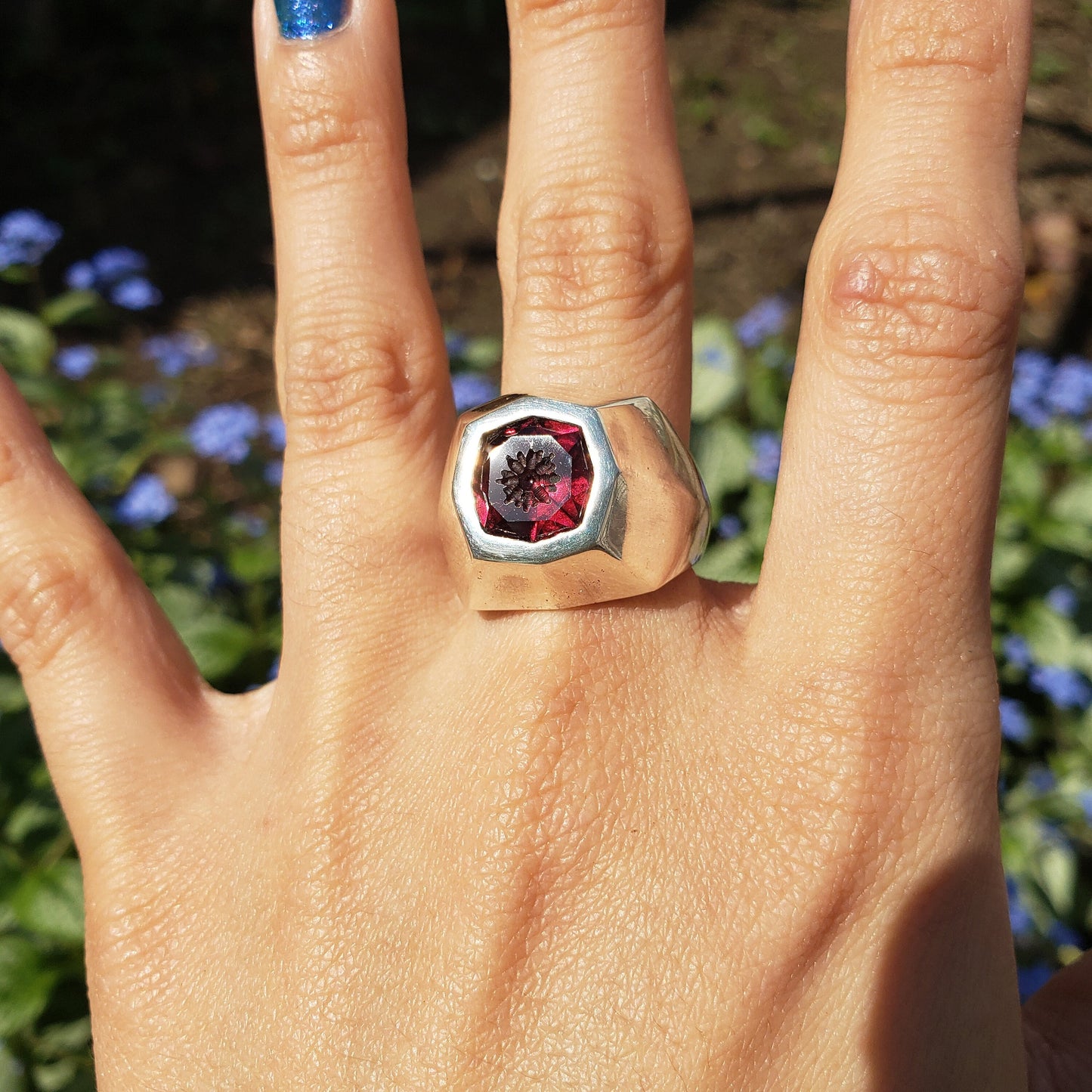 Radial flower garnet signet ring