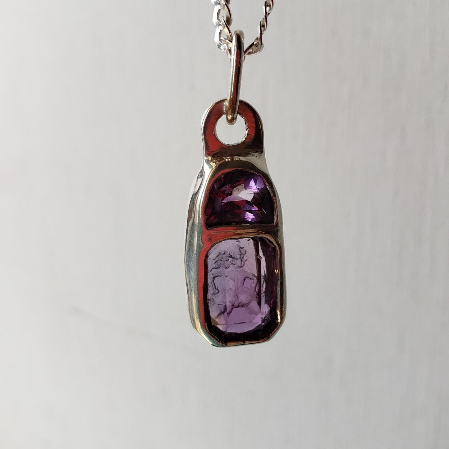 Reverse intaglio butt amethyst pendant