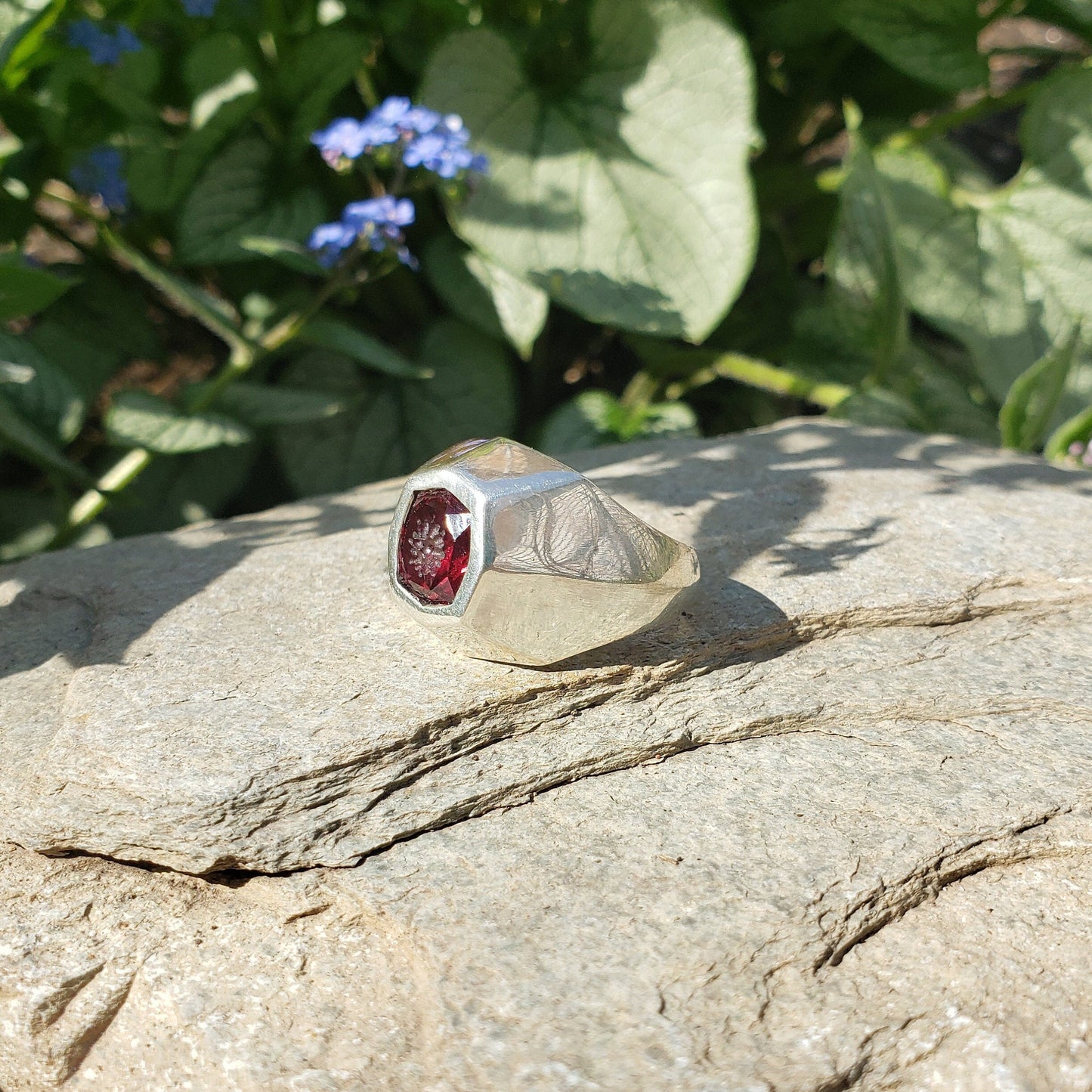 Radial flower garnet signet ring