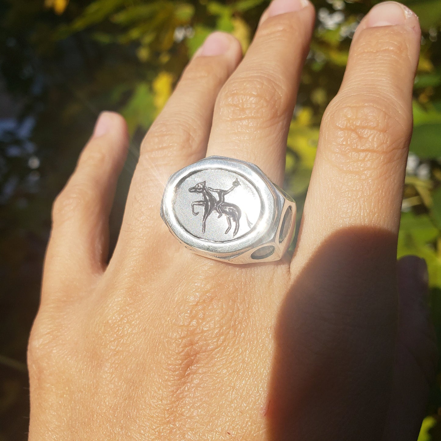 Headless horseman intaglio garnet signet ring