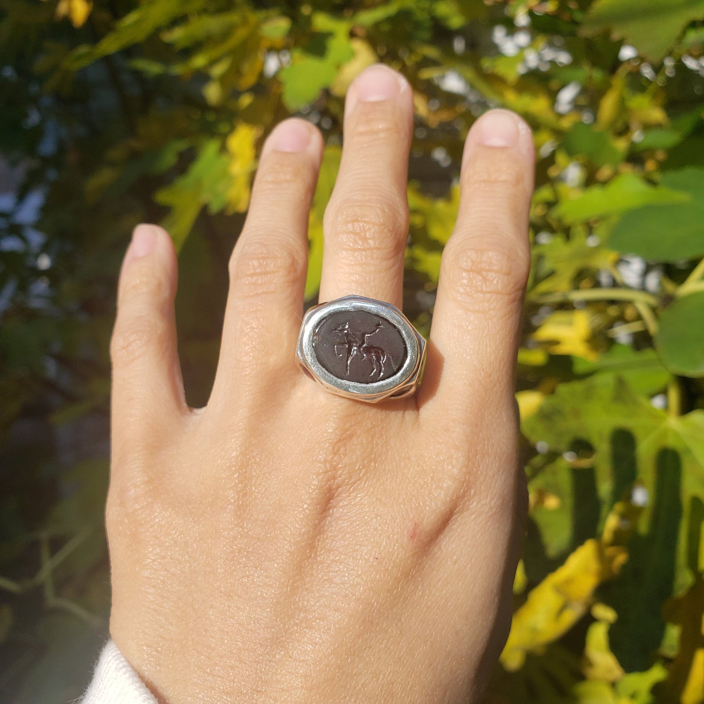 Headless horseman intaglio garnet signet ring