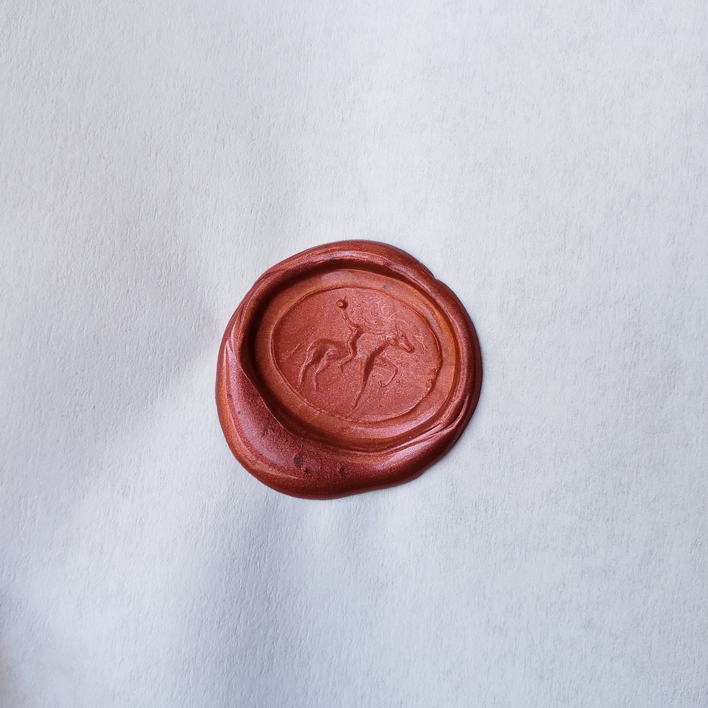 Headless horseman intaglio garnet signet ring