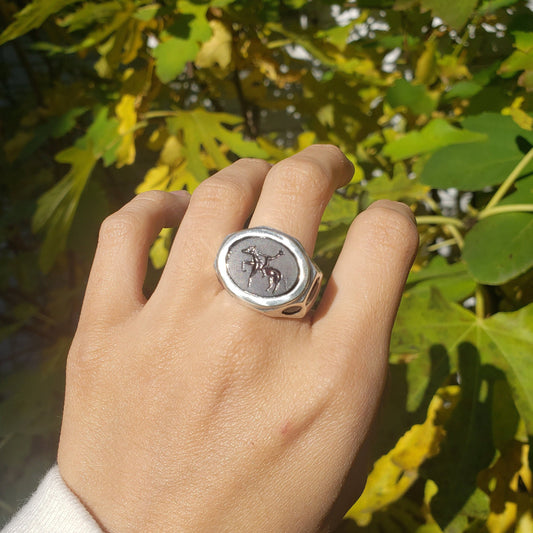 Headless horseman intaglio garnet signet ring