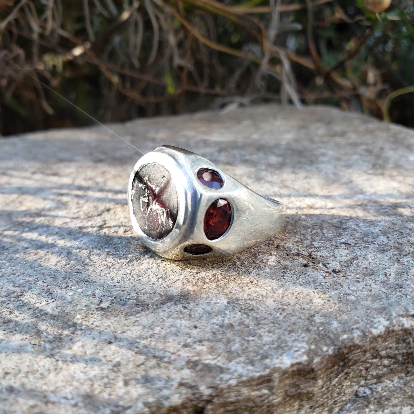 Headless horseman intaglio garnet signet ring