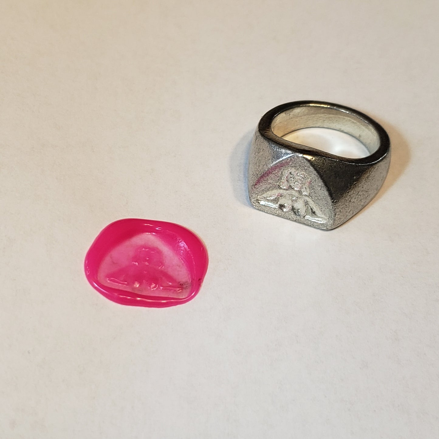 Between boobs wax seal signet ring