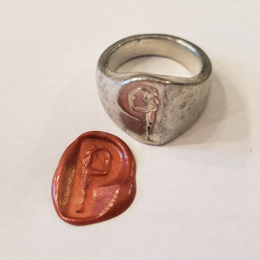 Body letter "p" touching toes wax seal signet ring