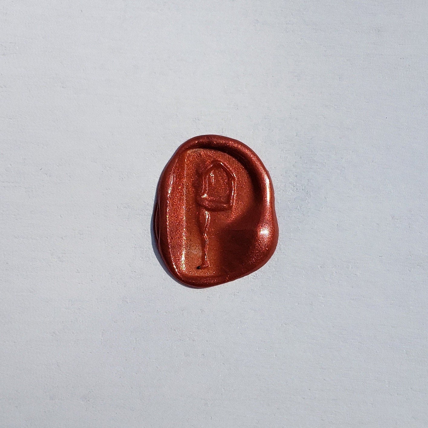 Body letter "p" touching toes wax seal signet ring